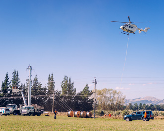 Helicopter installing power lines