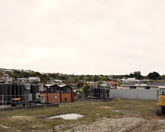 Image shows a panorama image of the Anderson's Bay Substation. There is a yellow digger in the right foreground.
