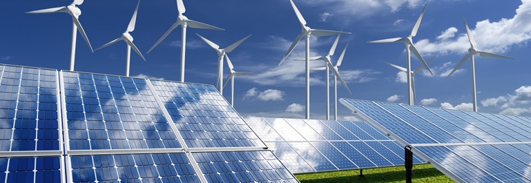 Solar panels and wind generators under blue sky
