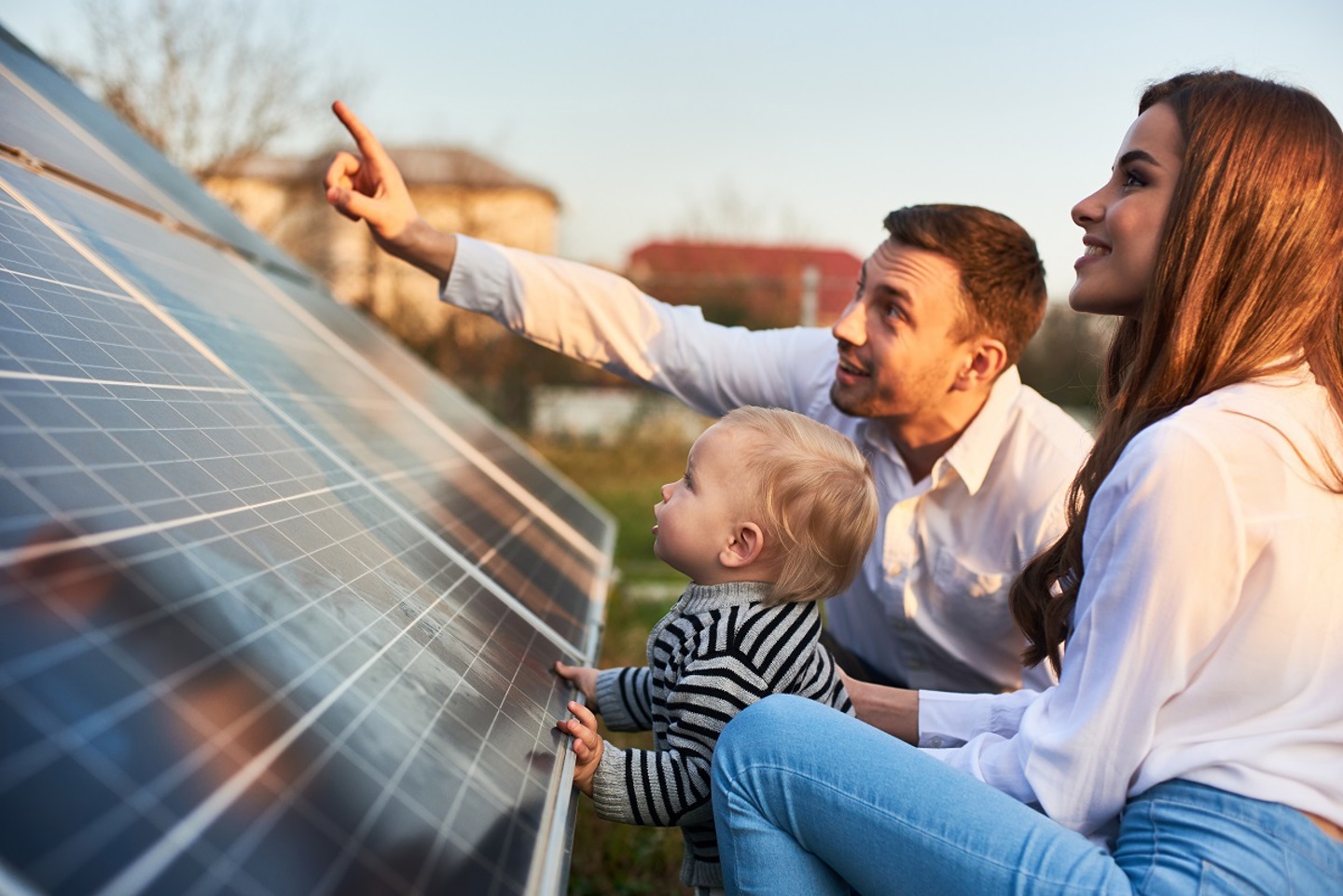 Image of two people looking at solar panels