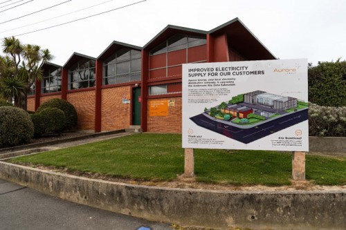 Photo of the currentANdersons Bay zone substation with billboard in front showing artist impression of the new substation